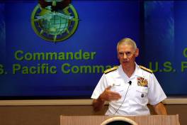 Commander, U. S. Pacific Command (USPACOM) Adm. William J. Fallon addresses the Fellows of Executive Course 2005-2 in the auditorium at the Asia-Pacific Center for Security Studies Aug. 3. Adm. Fallon analogized the importance of teamwork aboard an aircraft carrier with teamwork among countries in the Asia-Pacific region.