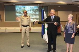 Acting Director Brig. Gen. (Ret.) Jim Hirai receives the streamer  for the APCSS flag from Gen. Muhammed Amer Goraya of Pakistan