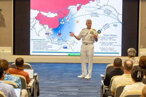 Adm. Koehler speaking in front of the Stackpole Auditorium to CSC 25-2 Fellows